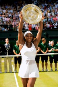 Serena Williams celebrates beating Garbine Muguruza in the Ladies' Singles Final during day Twelve of the Wimbledon Championships at the All England Lawn Tennis and Croquet Club, Wimbledon. PRESS ASSOCIATION Photo. Picture date: Saturday July 11, 2015.  See PA Story TENNIS Wimbledon. Photo credit should read: Adam Davy/PA Wire. RESTRICTIONS: Editorial use only. No commercial use without prior written consent of the AELTC. Still image use only - no moving images to emulate broadcast. No superimposing or removal of sponsor/ad logos. Call +44 (0)1158 447447 for further information.