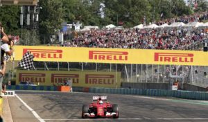 Ferrari Formula One driver Sebastian Vettel of Germany crosses the finish line to win the Hungarian F1 Grand Prix at the Hungaroring circuit, near Budapest, Hungary Sunday, July 26, 2015. REUTERS/Ronald Zak/Pool