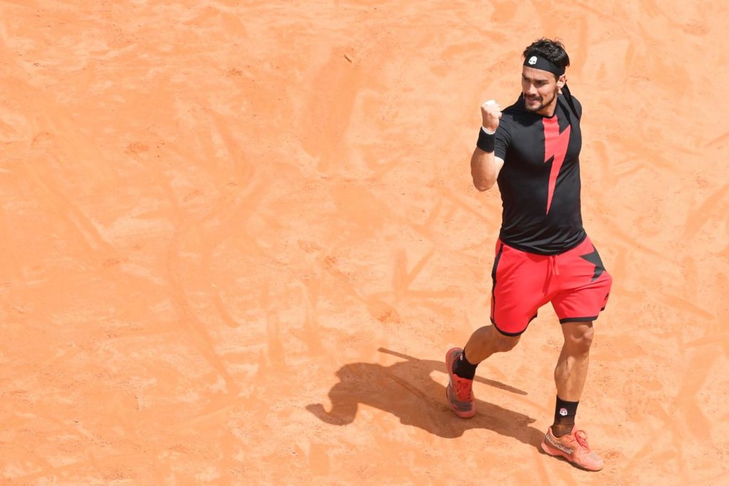 Italy's Fabio Fognini prepares a return to Austria's Dominic Thiem during Rome's ATP Tennis Open tournament at the Foro Italico, on May 16, 2018 in Rome. / AFP PHOTO / Tiziana FABI